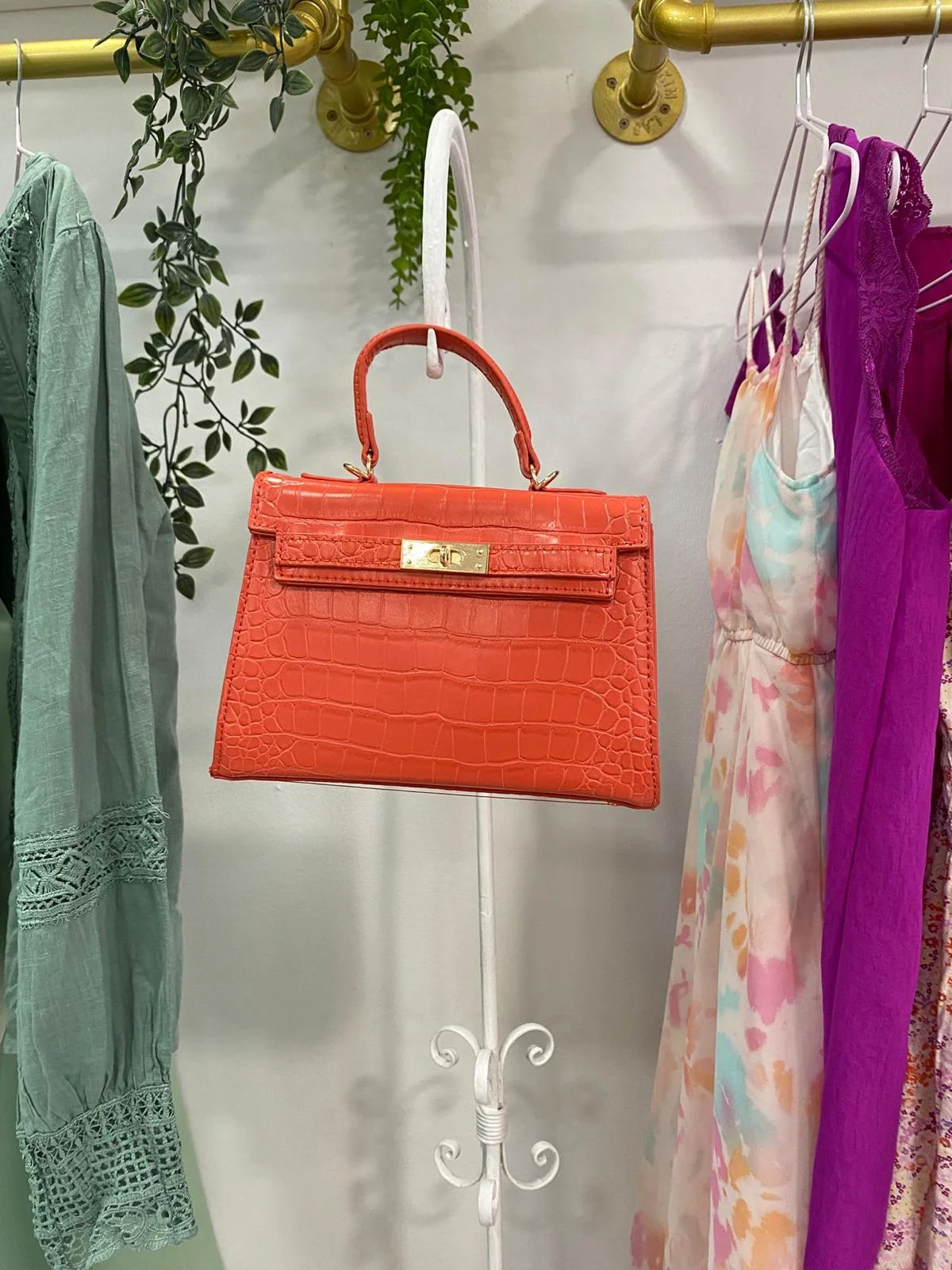 Bolso de mano naranja efecto cocodrilo