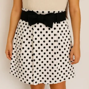 Falda blanca de lunares con lazo negro